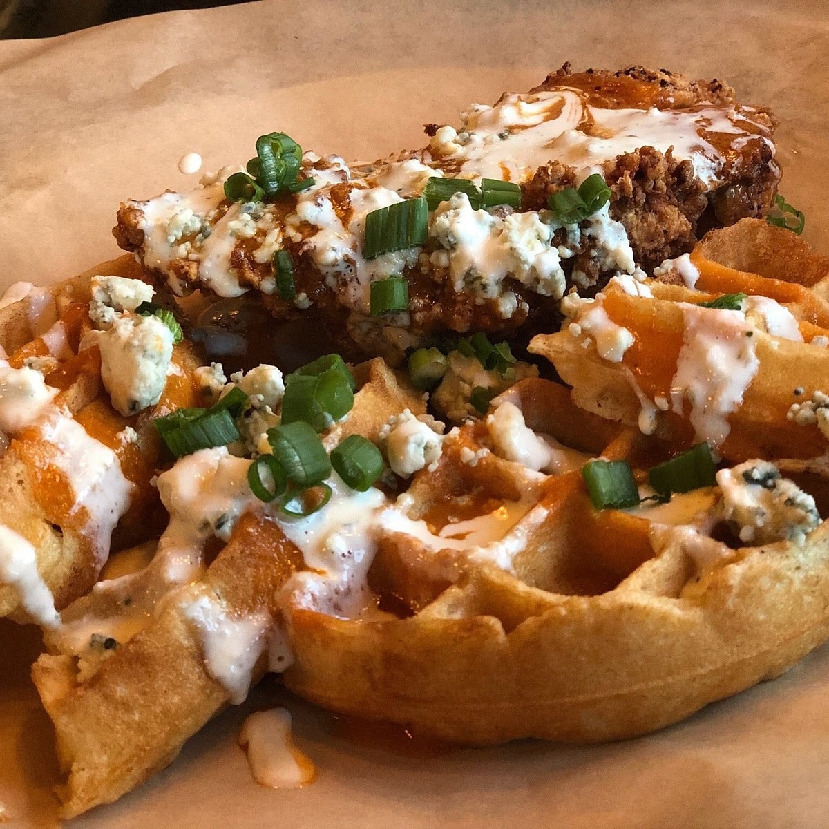Ring of Fire: buffalo fried chicken on a waffle with bleu cheese, ranch, and scallions